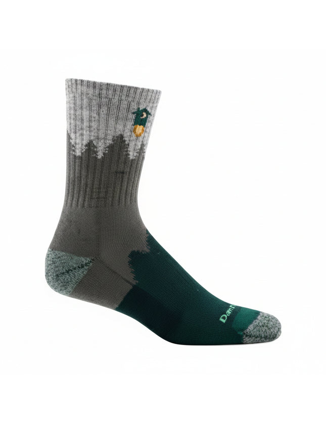 Grey and green sock with a forest and duck design