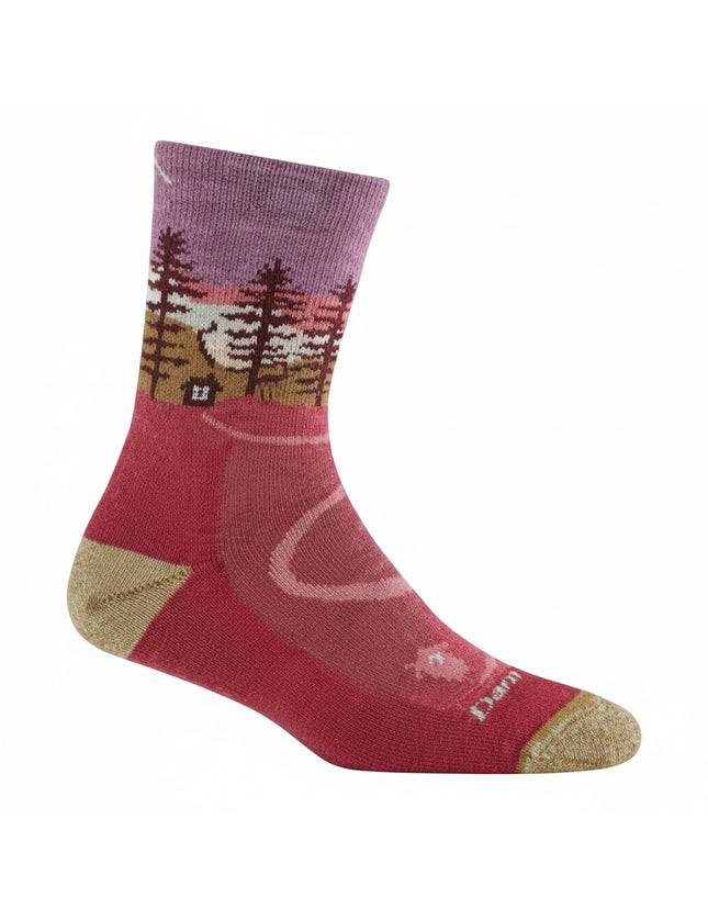 Red sock with a purple cuff and a forest and cabin design