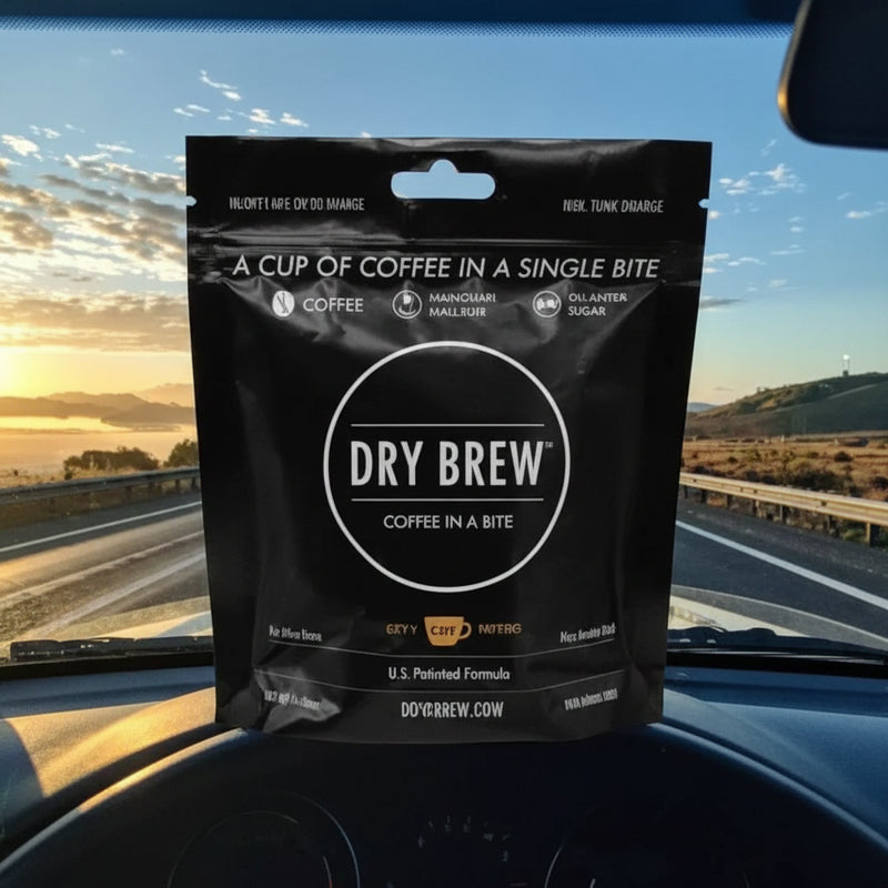 Dry Brew coffee in a bite pouch on a car dashboard with a sunrise background