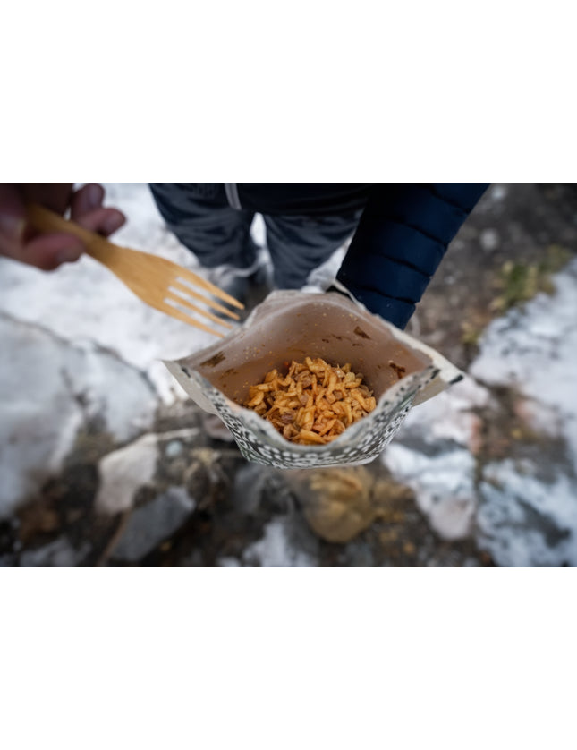 Dehydrated meal in a pouch with a wooden spork