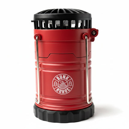 Red camping lantern with black top and base, and a white Bunk Hohoe logo