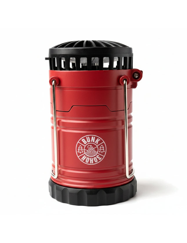 Red camping lantern with black top and base, and a white Bunk Hohoe logo