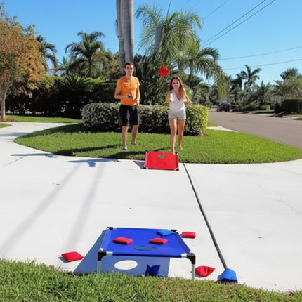 Couple playing outdoor game with blue and red targets