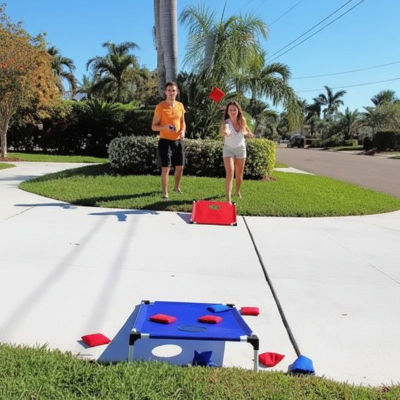 Couple playing outdoor game with blue and red targets