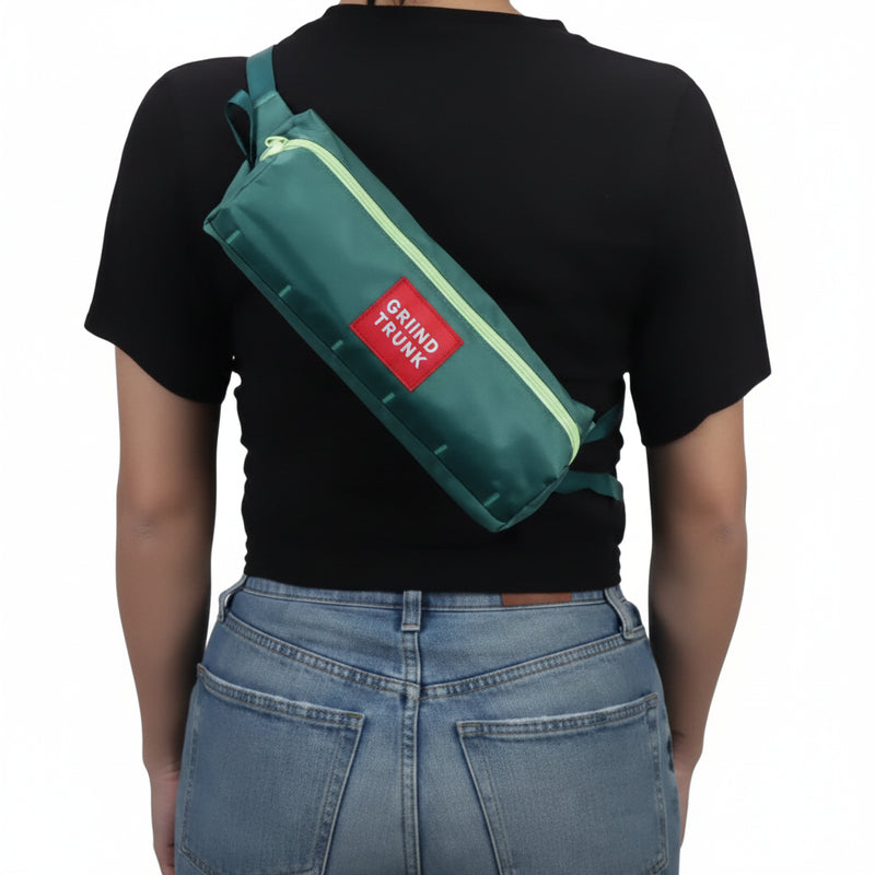 Person wearing a teal sling bag with a red label on their back
