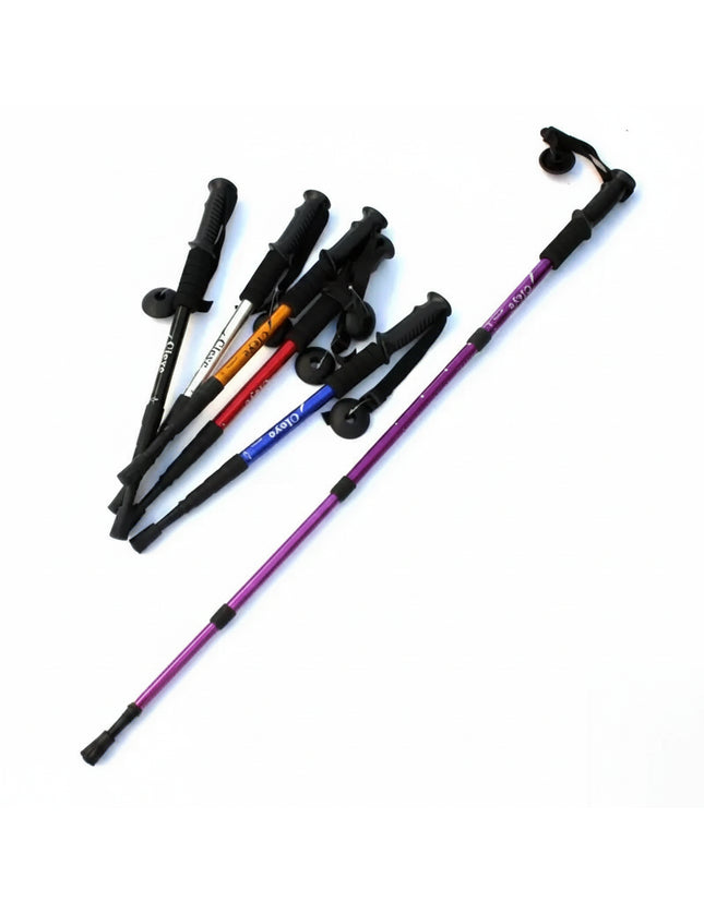 Assortment of colorful trekking poles with black handles and baskets, one purple pole extended