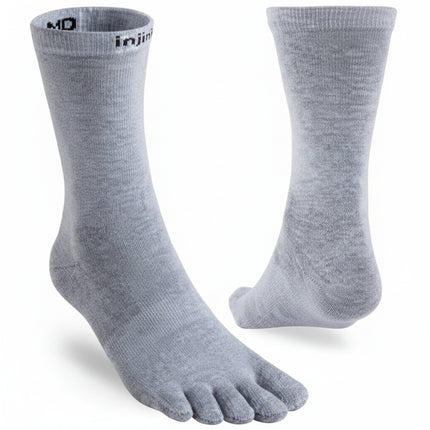 Light grey Injinji toe socks, one shown from the side and the other from the back