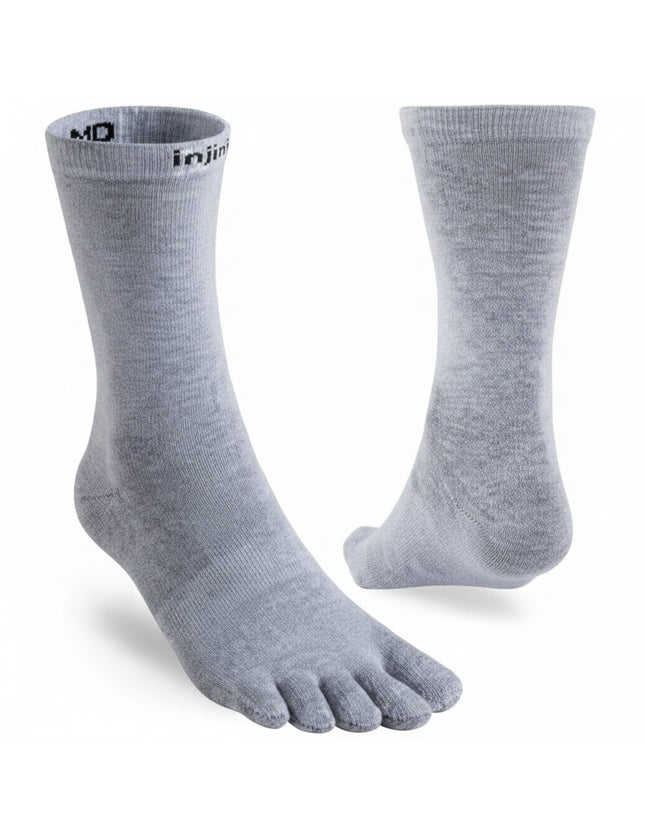 Light grey Injinji toe socks, one shown from the side and the other from the back