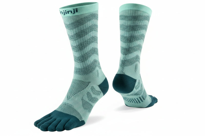 Pair of Injinji toe socks in light green with dark green toes and heels
