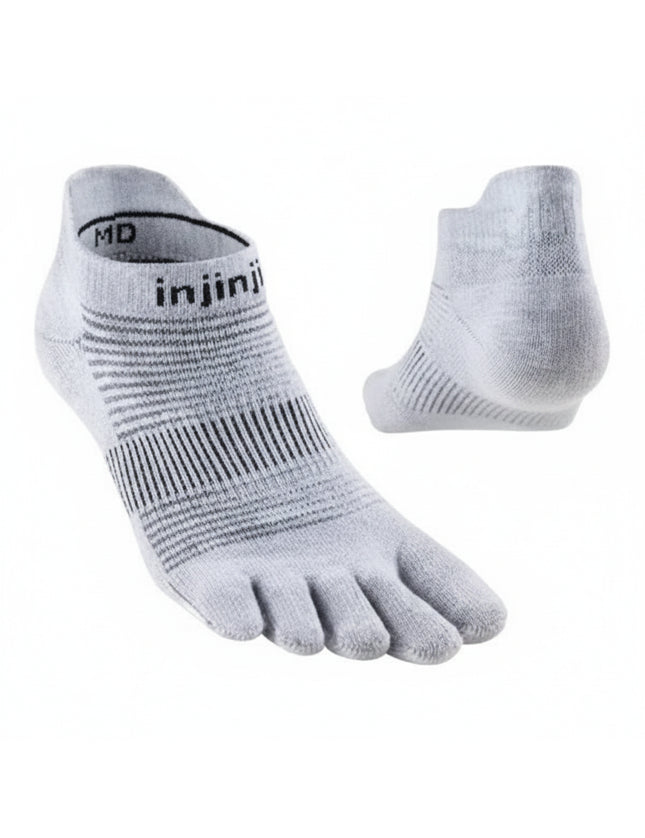Pair of light grey Injinji toe socks with black stripes on a white background