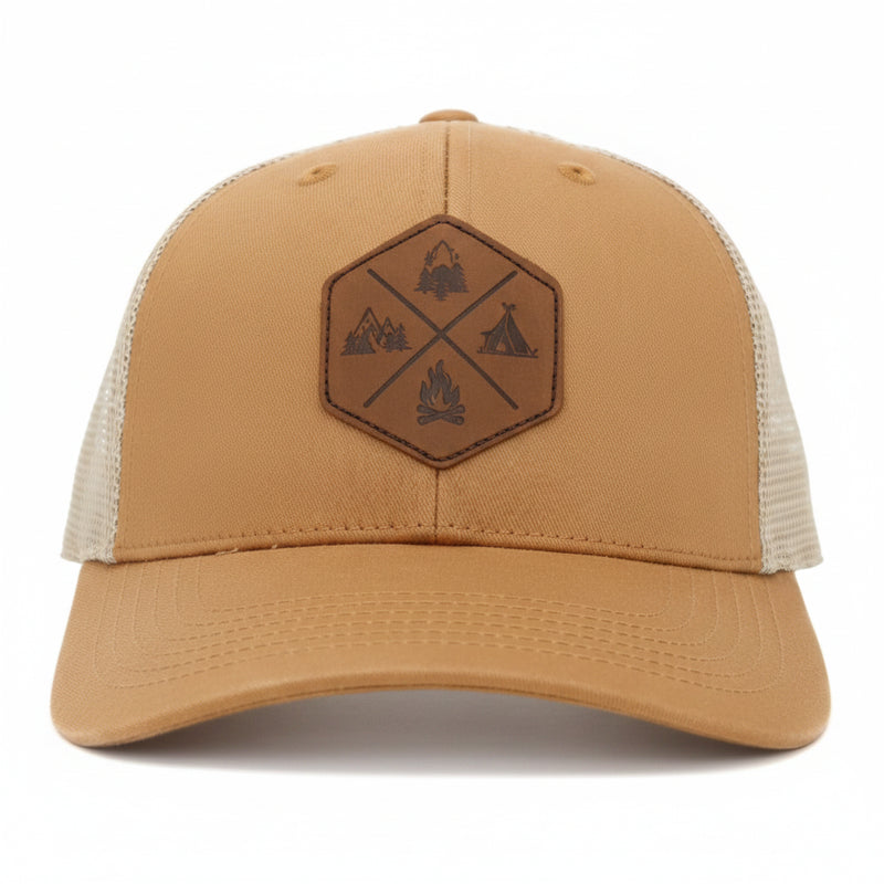 Brown baseball cap with a hexagonal leather patch featuring outdoor-themed icons