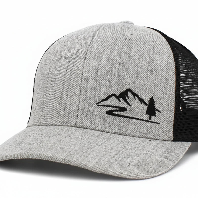 Grey and black trucker hat with a mountain and tree logo