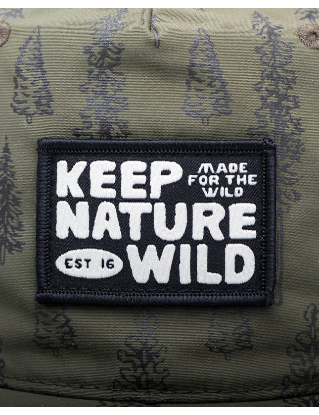 Close-up of a rectangular embroidered patch on olive green camouflage fabric. The patch is black with white text reading 'KEEP NATURE WILD' and smaller text 'MADE FOR THE WILD' and 'EST 16'.