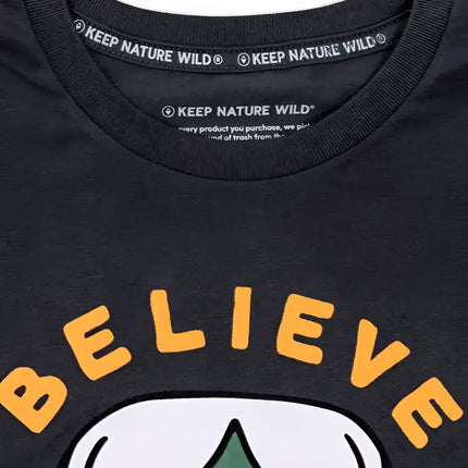 Close up of a black t-shirt with the words Keep Nature Wild on the collar and Believe on the chest