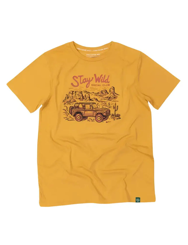 Mustard yellow t-shirt with a graphic of a desert landscape, an off-road vehicle, and Stay Wild Social Club text