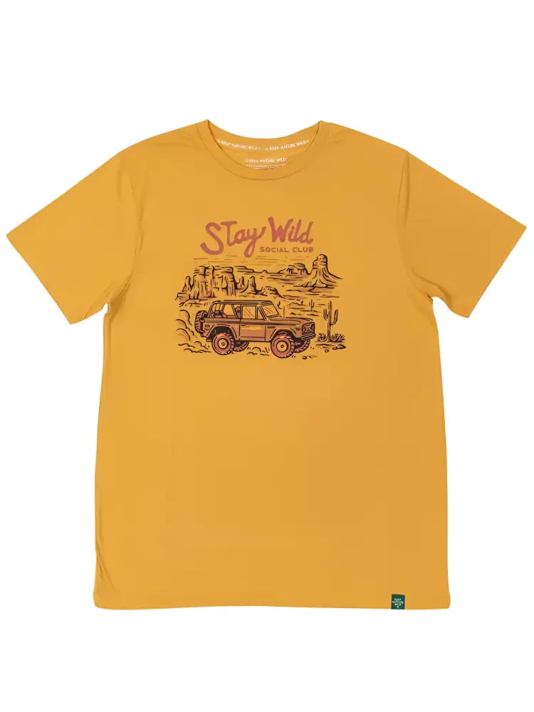 Mustard yellow t-shirt with a graphic of an off-road vehicle in a desert landscape and Stay Wild Social Club text