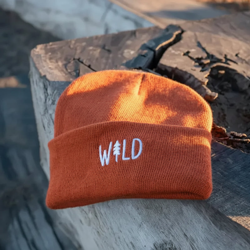 Orange beanie with white embroidered WILD logo