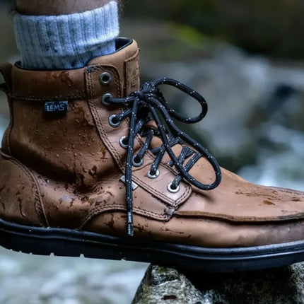 Brown leather waterproof hiking boot with black laces and a black sole