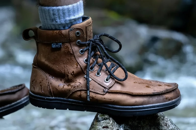 Brown leather waterproof hiking boot with black laces and a black sole