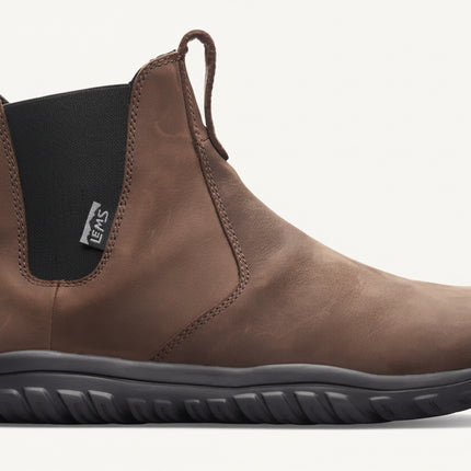 Brown leather Chelsea boot with black elastic side panel and black sole