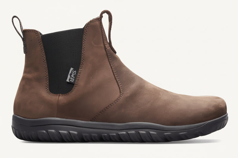 Brown leather Chelsea boot with black elastic side panel and black sole