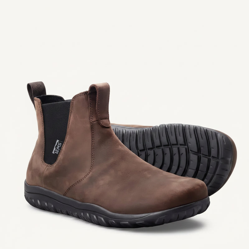 Pair of brown leather Chelsea boots with black elastic side panels and black soles