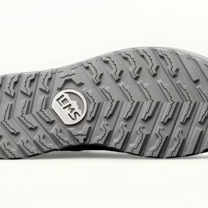 Underside of a gray shoe sole with a textured tread pattern and the LEMS logo