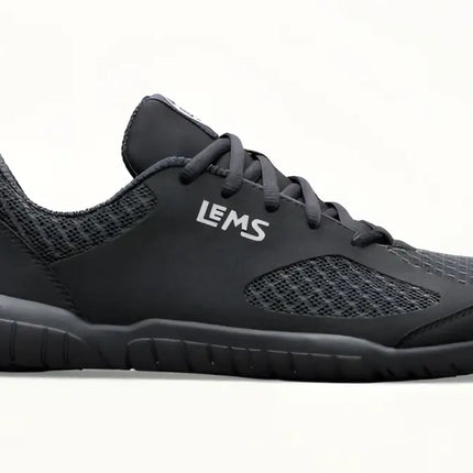 Black Lems shoe with mesh upper and black laces on a white background