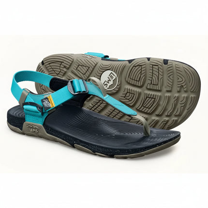 Pair of Lems sandals, one upright showing the blue straps and black sole, the other inverted showing the tread