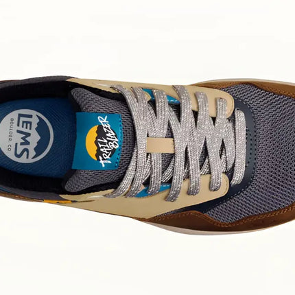 Overhead view of a brown, tan, and blue Lems Trailblazer shoe with silver laces