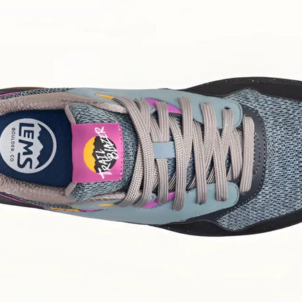 Top down view of a grey and black Trailblazer shoe with pink accents and grey laces