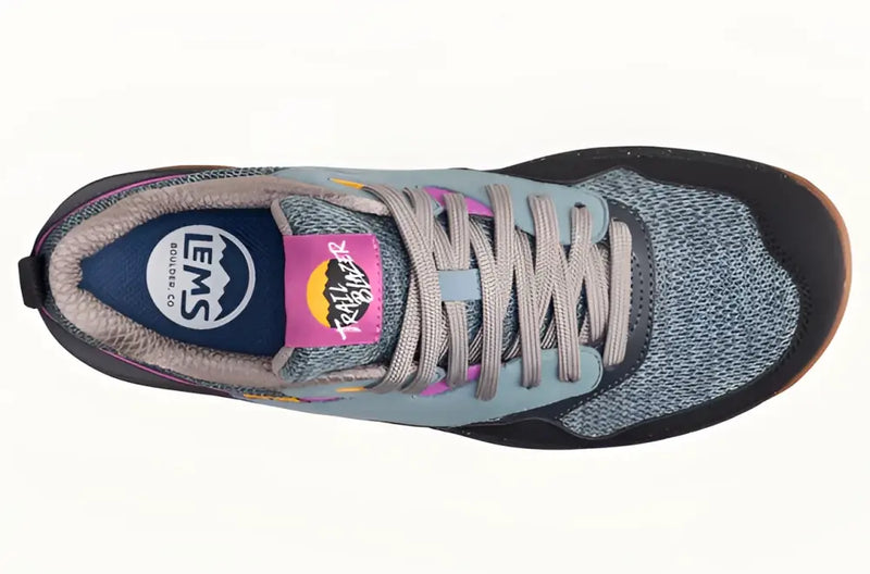 Top down view of a grey and black Trailblazer shoe with pink accents and grey laces