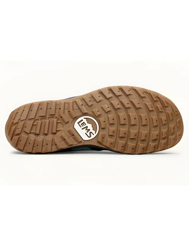 Brown rubber sole of a shoe with a Lems logo