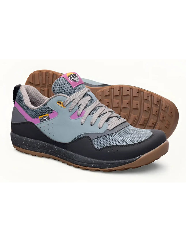 Pair of Lems Trailhead V2 shoes in gray, black, and pink with brown soles