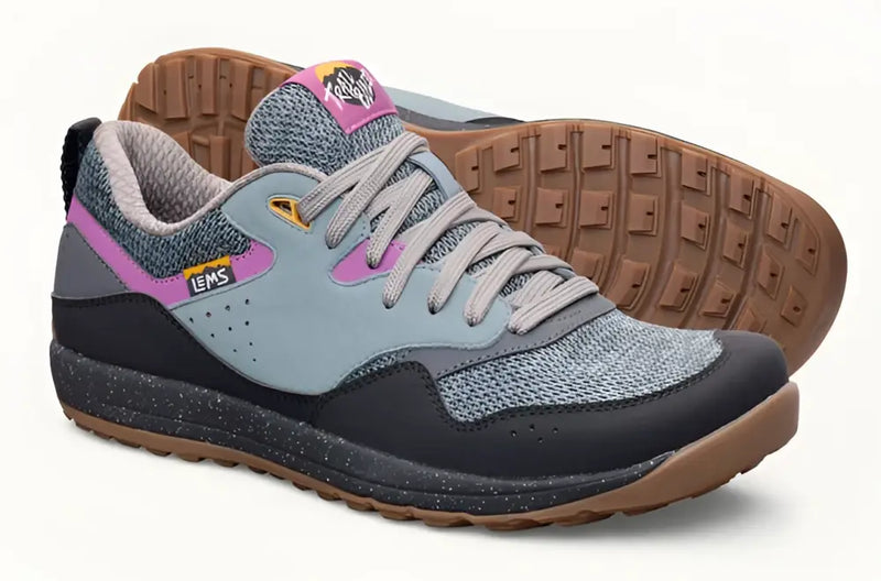 Pair of Lems Trailhead V2 shoes in gray, black, and pink with brown soles