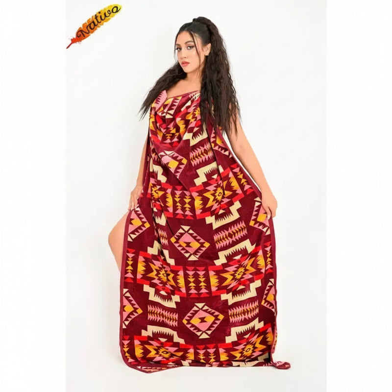 Woman in a long, patterned dress with geometric designs in red, pink, and yellow
