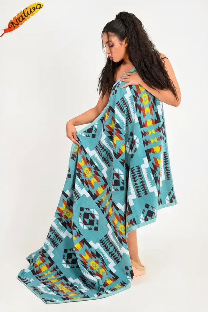 Woman holding a blue, yellow, red, and black patterned blanket