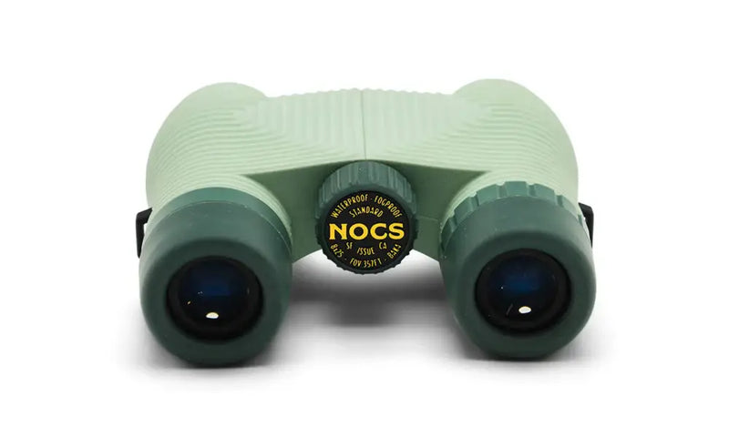 Nocs Provisions green binoculars with black lenses and a central black and yellow Nocs logo