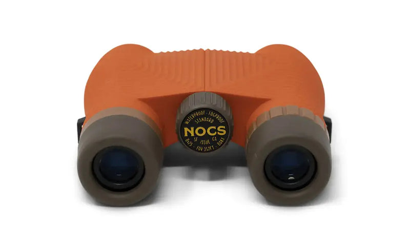 Orange Nocs Provisions binoculars with dark brown accents and a central focus wheel