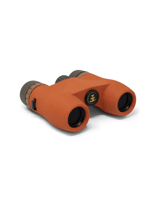 Orange binoculars with black lenses and a gold logo on the side