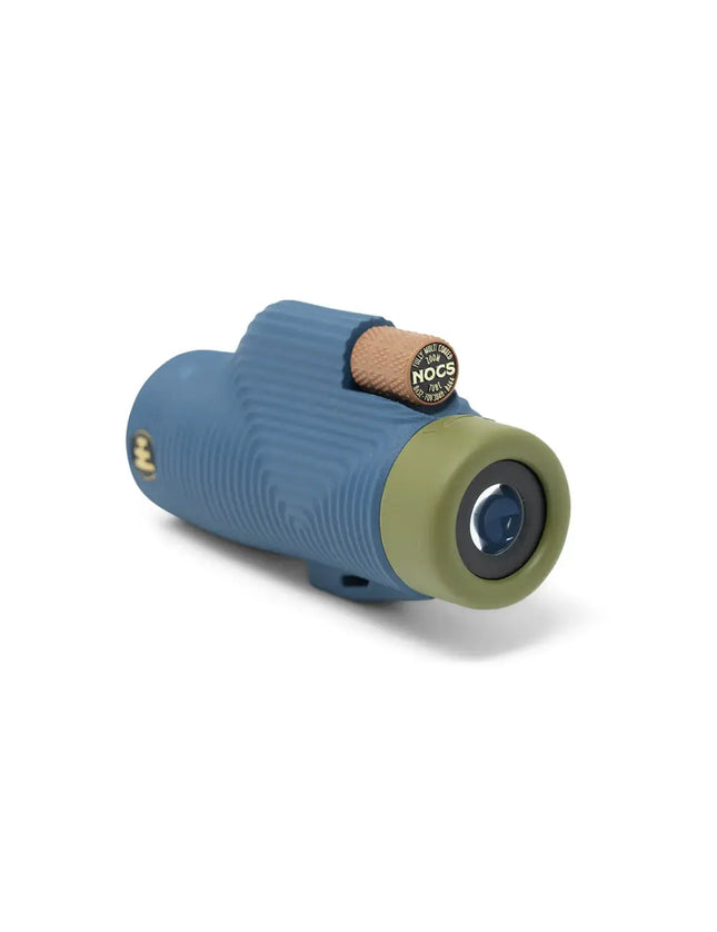 Blue and green monocular with a brown textured focus wheel
