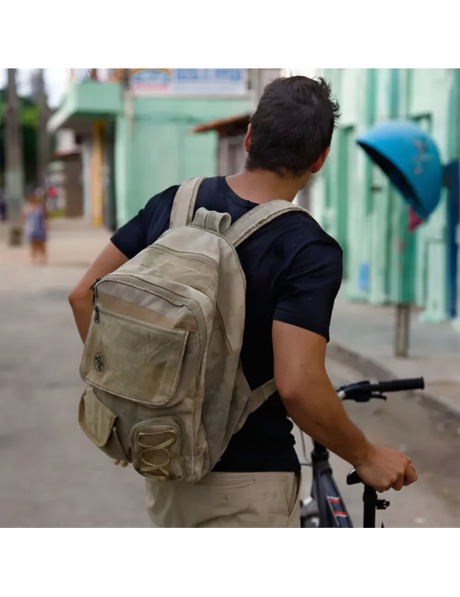 Man with a backpack and bicycle on a street