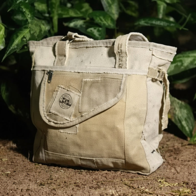 Beige canvas tote bag with front pocket and handles