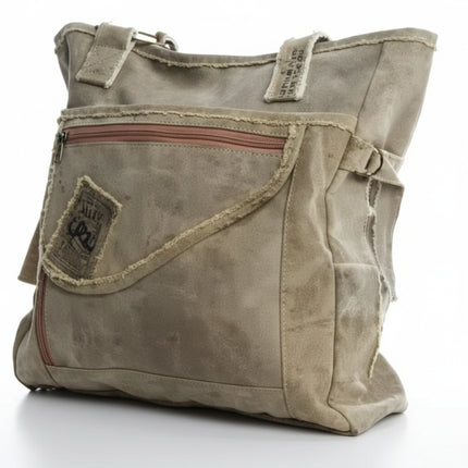 Khaki canvas tote bag with a front zipper pocket and distressed details