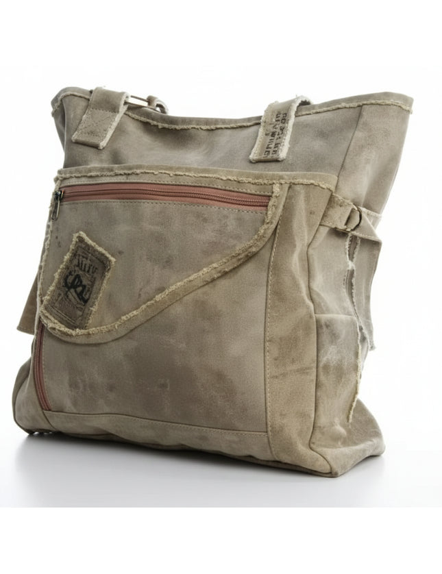 Khaki canvas tote bag with a front zipper pocket and distressed details