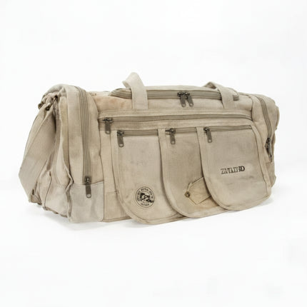 Beige duffel bag with multiple zippered pockets and a small logo on the front