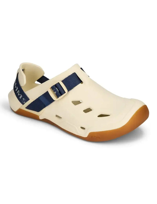 Cream colored water shoe with blue strap and brown sole