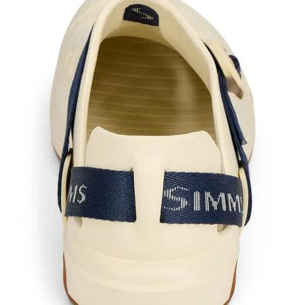 Back view of a cream-colored fishing clog with a navy blue strap featuring the Simms logo