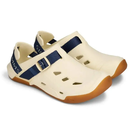 Pair of cream-colored wading sandals with navy blue straps and brown soles