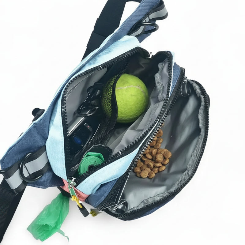 Blue dog walking bag with tennis ball, dog food, and poop bags